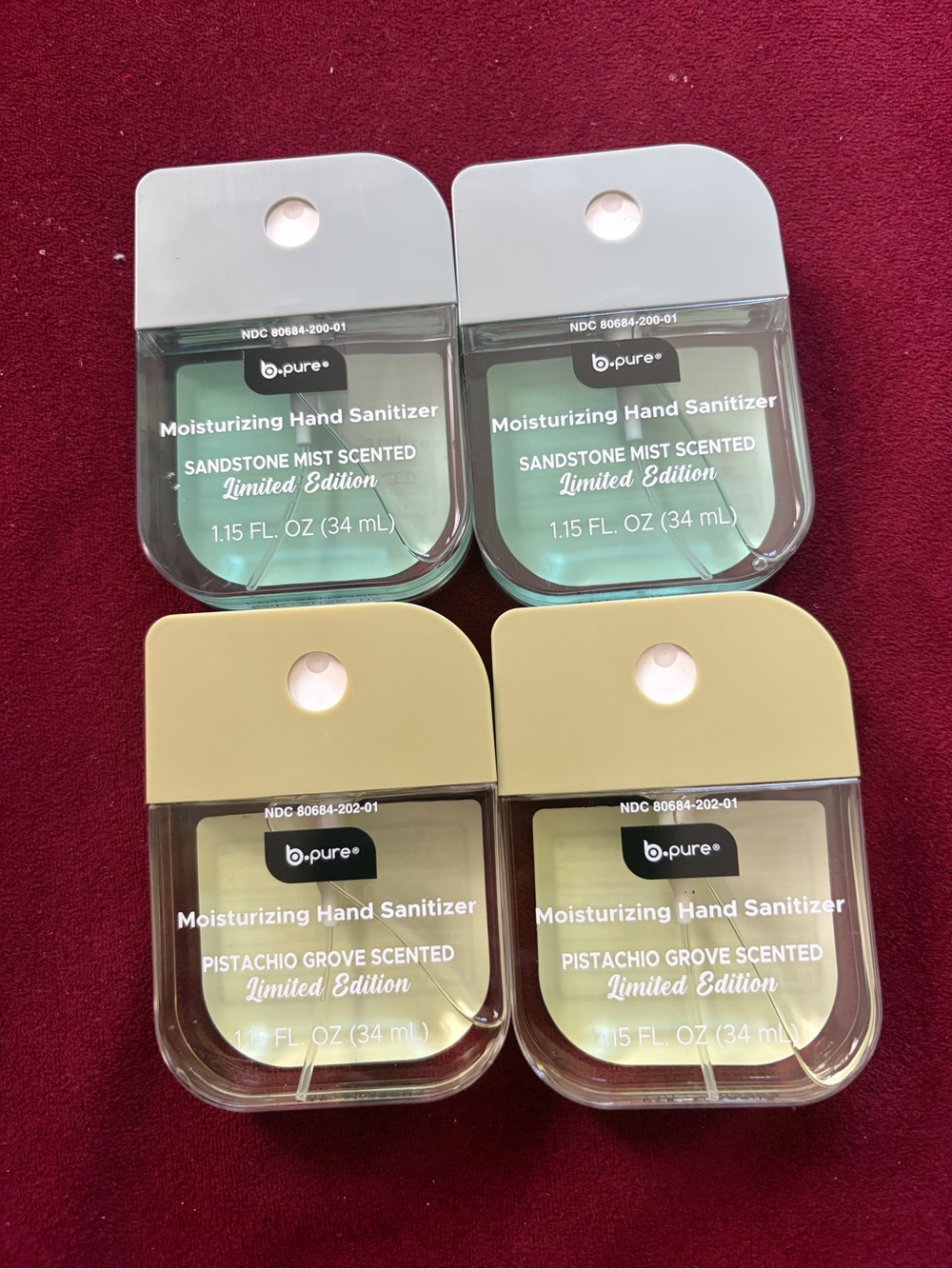 B. Pure hand sanitizers. Pistachio grove scented and Sandstone mist scented.